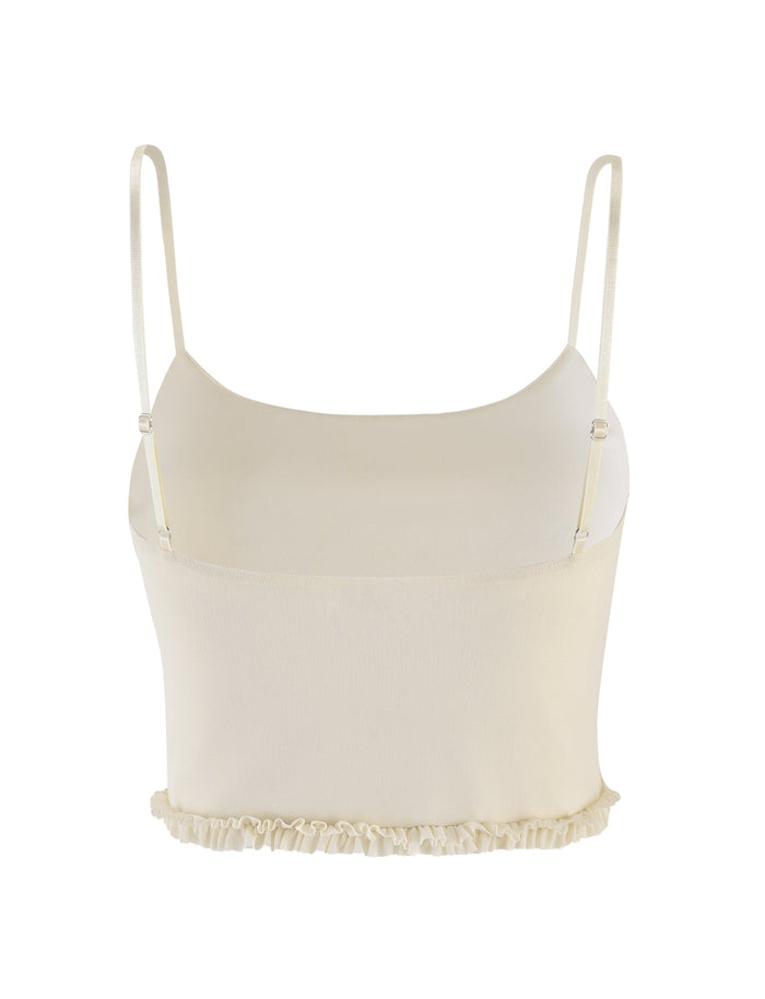 The MAISIE TOP by TIGERMIST is a pale yellow mesh camisole crop top featuring thin adjustable straps and a delicate frill detail along the ruffled hem.
