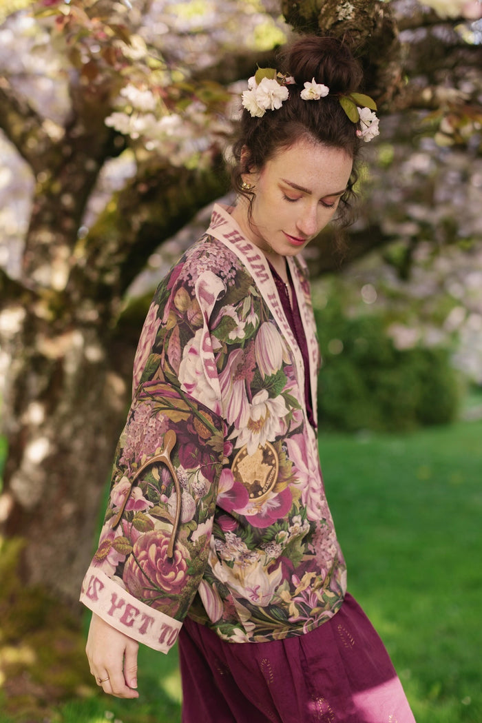 Model wearing cropped kimono featuring gold wishbone–vintage coin–evening star–dandelion–and spring floral collage with “Make a wish” banner – Market of Stars