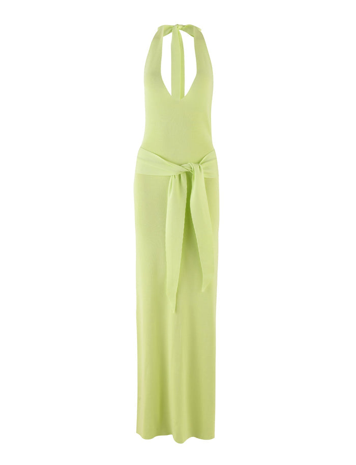 The MAREE DRESS - GREEN by TIGERMIST is a light green knit halter-neck dress featuring a plunging neckline and a large matching sash tied in a bow at the waist. This maxi-length dress boasts a sleek, fitted design that exudes elegance and modernity.