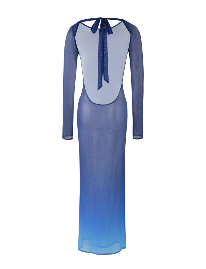 Introducing the MEILANI DRESS - BLUE : OMBRE from TIGERMIST, a long-sleeved sheer blue dress featuring an exquisite ombré gradient that fades to a lighter blue at the hem. This dress boasts a stunning backless design tied at the neck with a delicate ribbon, crafted from lightweight and semi-transparent material.