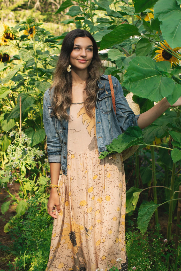 Model wearing the Milk & Honey Bohéme Slip Dress featuring nostalgic 1904 Brooklyn artwork, vintage woodcut stars, and Hoytema’s antique floral print – Market of Stars.