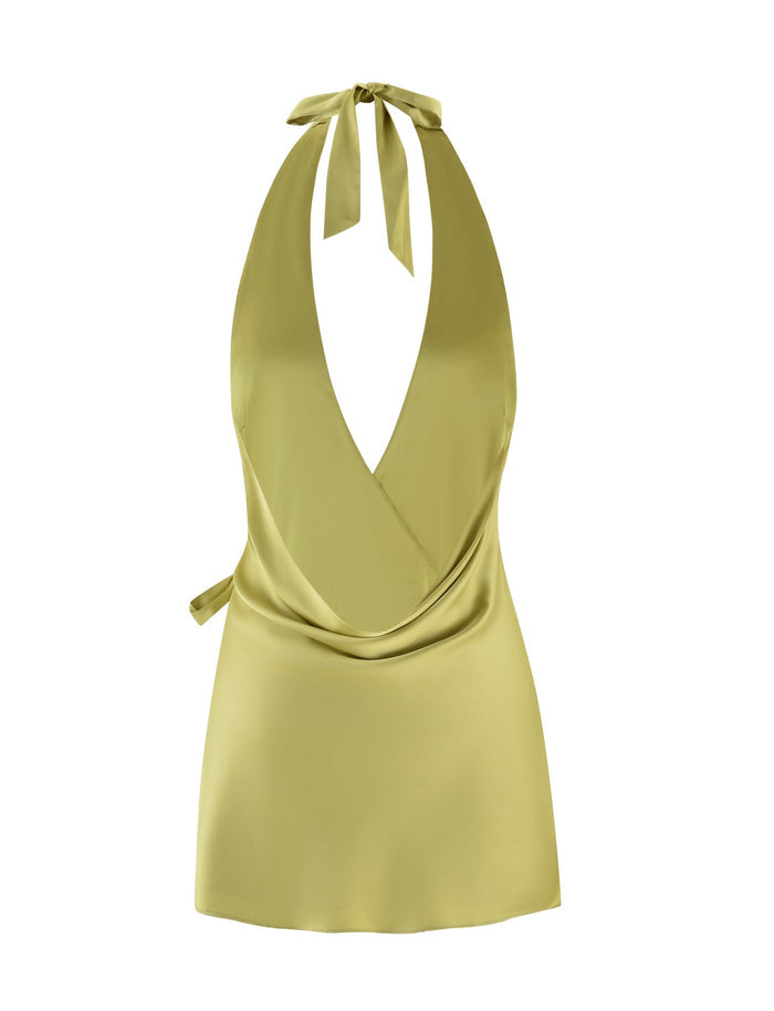 Introducing the Monroe 2.0 Mini Dress by Tigermist: a stylish, sleeveless pistachio-green satin wrap top featuring a deep V-neck and wide halter straps that tie elegantly at the back. This sophisticated piece showcases a draped front and wrap-around design, making it an ideal addition to elevate your wardrobe.