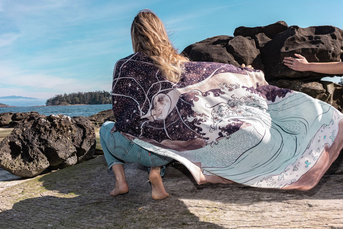 Model wearing Moonstruck Goddess Duster featuring original artwork by Leslie Love, inspired by the ocean, the night sky, and the artist’s handmade botanical inks – Market of Stars.
