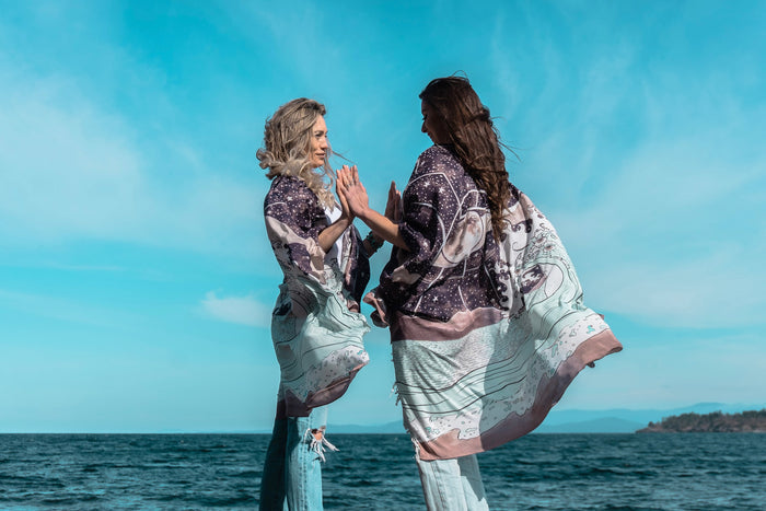 Model wearing Moonstruck Goddess Duster featuring original artwork by Leslie Love, inspired by the ocean, the night sky, and the artist’s handmade botanical inks – Market of Stars.