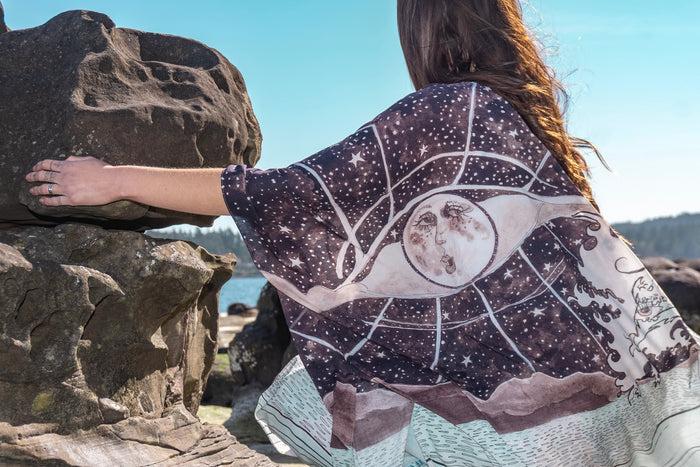Model wearing Moonstruck Goddess Duster featuring original artwork by Leslie Love, inspired by the ocean, the night sky, and the artist’s handmade botanical inks – Market of Stars.