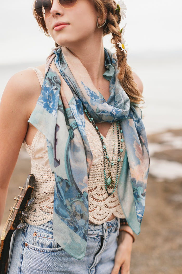 Model wearing a light, airy bamboo-based viscose scarf to wrap yourself in good vibes, wanderlust, and a little rebellion - Market of Stars