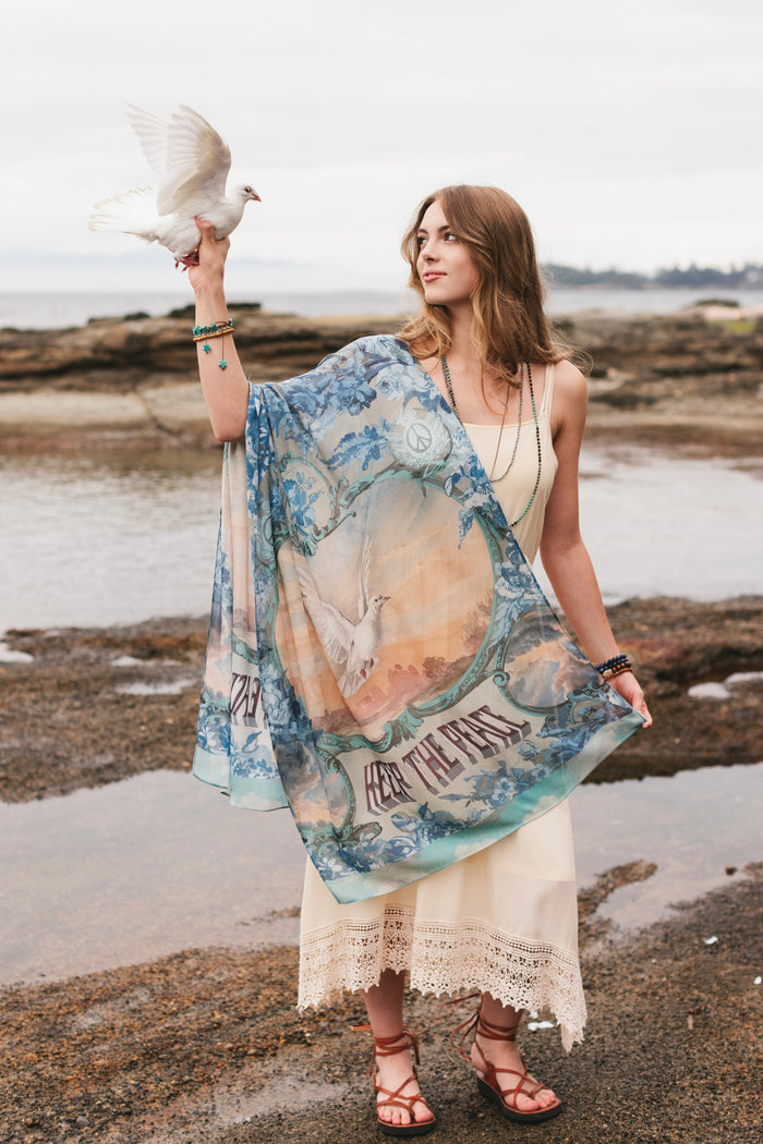 Model wearing a light, airy bamboo-based viscose scarf to wrap yourself in good vibes, wanderlust, and a little rebellion - Market of Stars