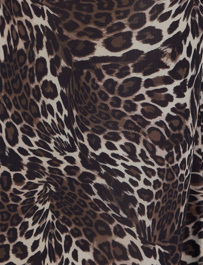 Close-up of TIGERMIST’s PEARL MAXI SKIRT - MULTI : LEOPARD fabric, featuring black and brown spots on beige for an abstract, textured look—ideal for a flowing maxi silhouette.