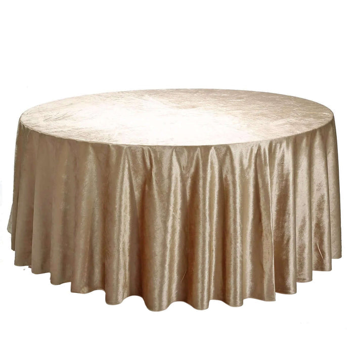 Round gold tablecloth with elegant draping.
