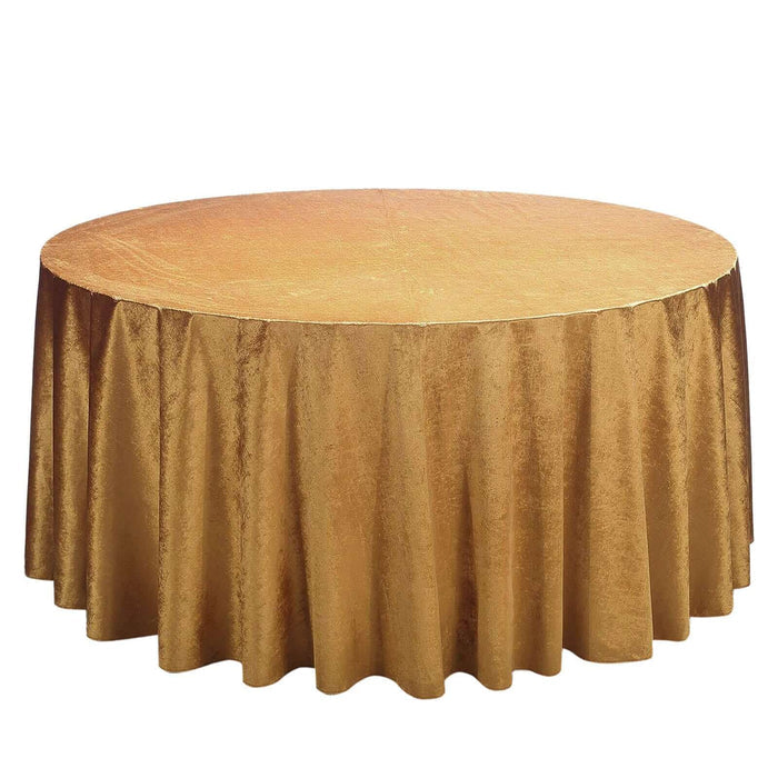 Gold round tablecloth on a plain white background.
