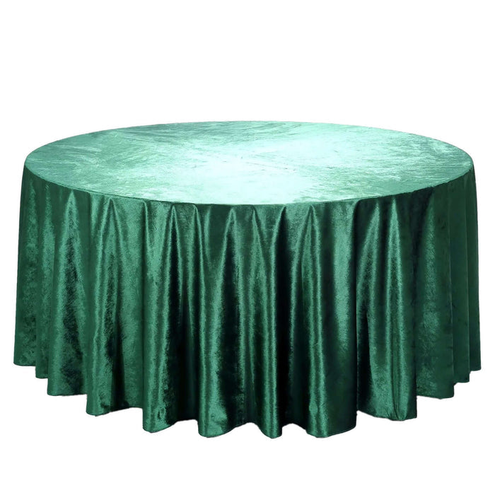 Green velvet tablecloth with elegant draping.