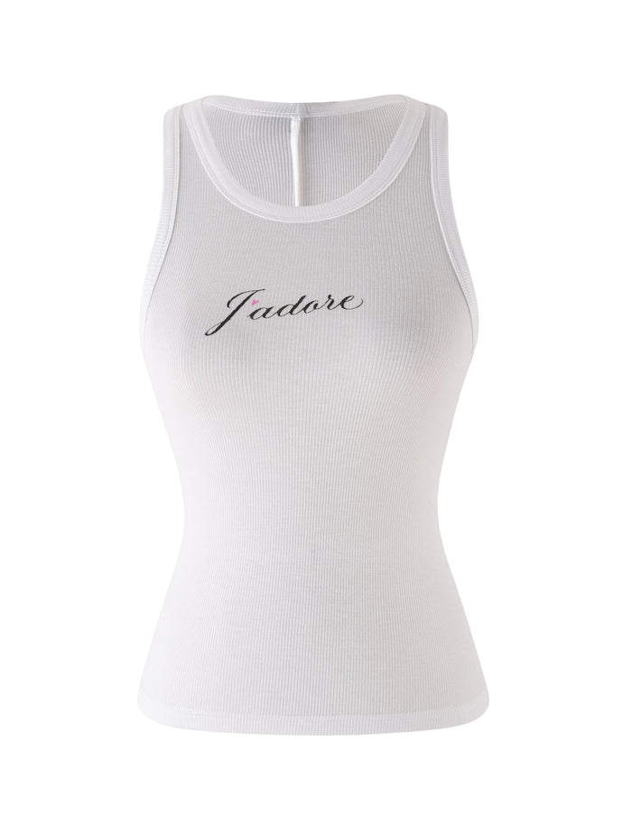 The RAFAELLA TANK by TIGERMIST is a white ribbed racerback tank top with a bodycon fit and "J'Adore" in black cursive across the chest.