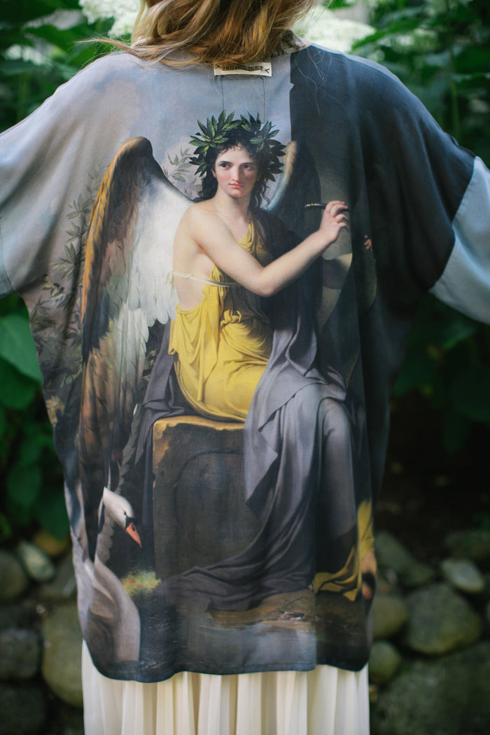 Model wearing Peace, Wine & Sunshine Bohéme Slip Dress featuring botanical collages and playful peace, wine and sunshine lettering on the hem – Market of Stars.