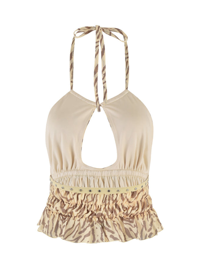 Image of the RUMER TOP - YELLOW : ZEBRA by TIGERMIST, a beige halter top featuring a keyhole cutout at the front, zebra print trim, and adjustable tie straps at the neck. The bottom hem has a ruffled zebra pattern, adding a decorative touch to this yellow zebra print top.
