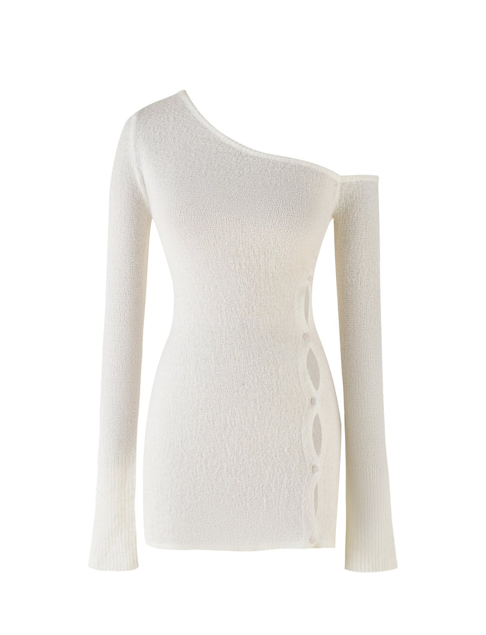 The RYKER DRESS - WHITE: CREAM from TIGERMIST features a slim fit and textured fabric, along with decorative circular cutouts that run along one side, adding a modern and stylish design element to the piece.