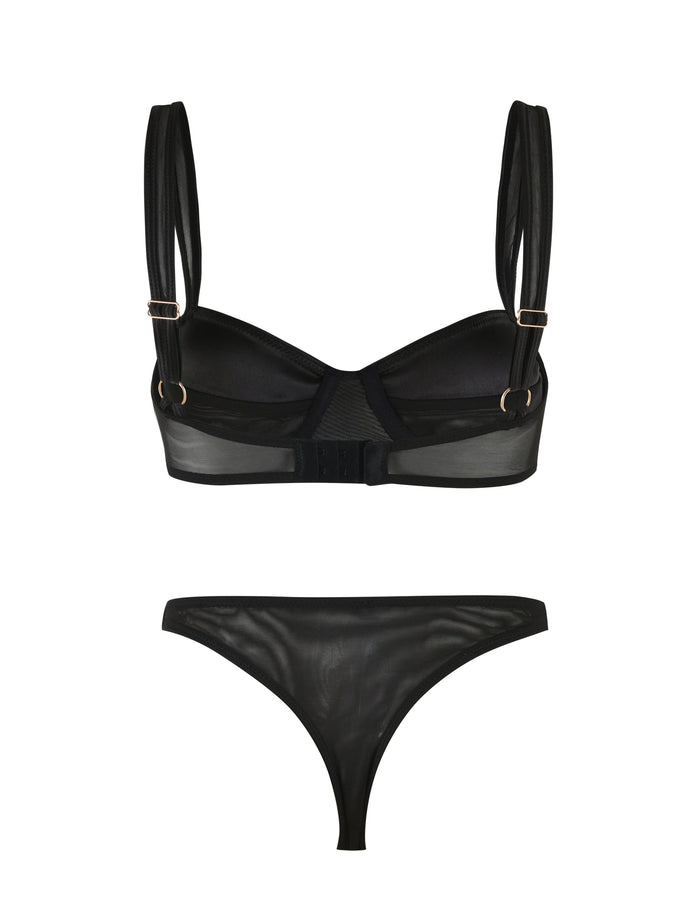 An image showing the SAFFRON SET 2.0 - BLACK by TIGERMIST. The set includes a sheer black bralette with straps and buckles in a balconette shape, and a pair of sheer black panties, both featuring a delicate and minimalist design.