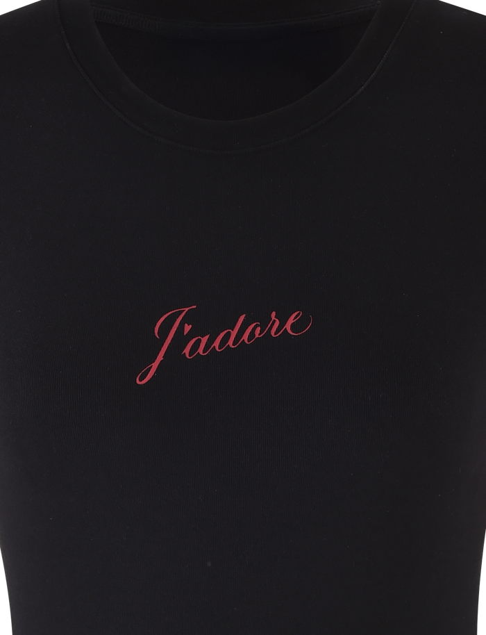 The SAPHIRA TEE - BLACK by TIGERMIST is a black standard tee with a J'Adore graphic embroidered in red cursive on the chest, crafted from high-stretch fabric for comfort and style.