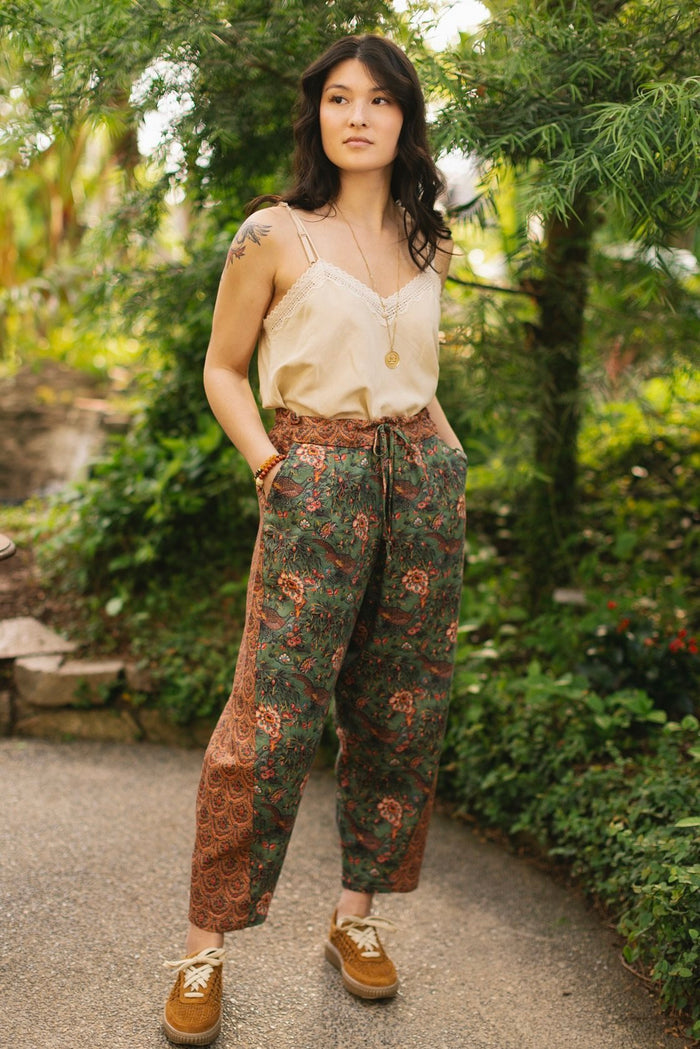 Model wearing Peace, Wine & Sunshine Bohéme Slip Dress featuring botanical collages and playful peace, wine and sunshine lettering on the hem – Market of Stars.