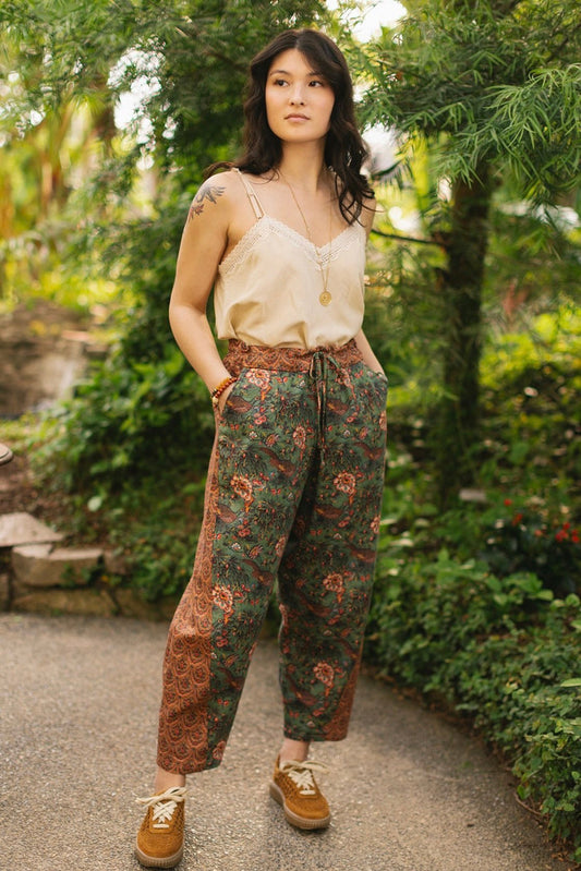 Model wearing Peace, Wine & Sunshine Bohéme Slip Dress featuring botanical collages and playful peace, wine and sunshine lettering on the hem – Market of Stars.