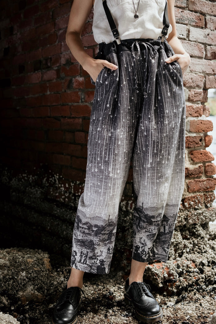Model wearing Peace, Wine & Sunshine Bohéme Slip Dress featuring botanical collages and playful peace, wine and sunshine lettering on the hem – Market of Stars.