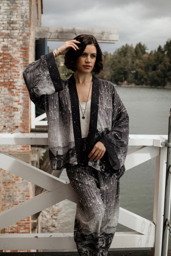 Model wearing our Stargazer cropped kimono featuring an antique engraving of a meteor shower and moonlit astronomy imagery – Market of Stars