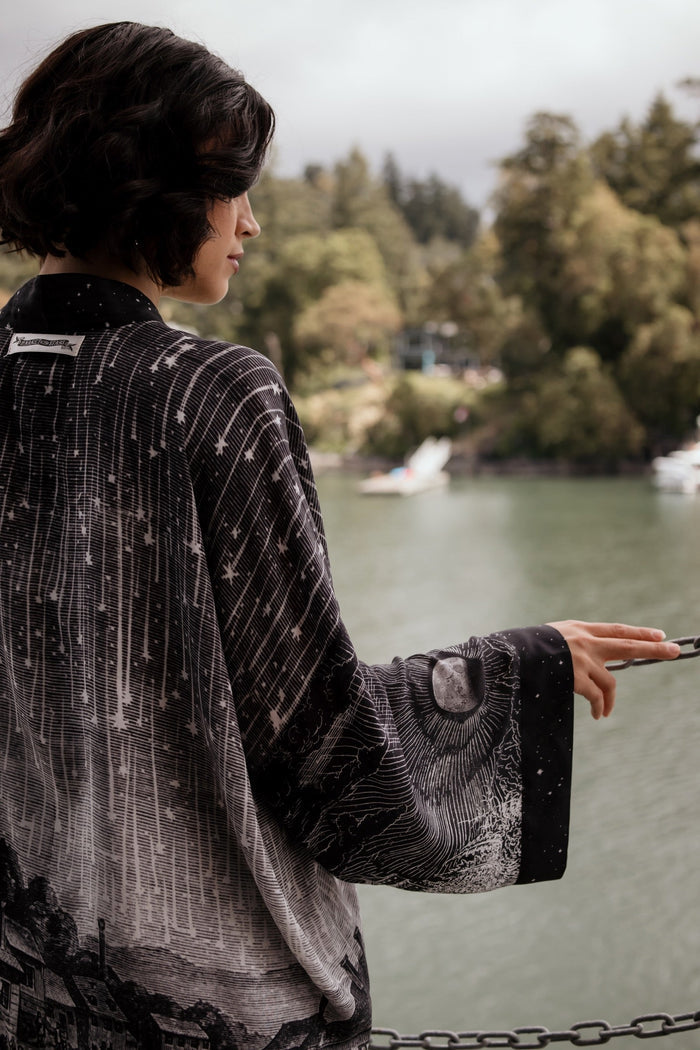 Model wearing our Stargazer cropped kimono featuring an antique engraving of a meteor shower and moonlit astronomy imagery – Market of Stars