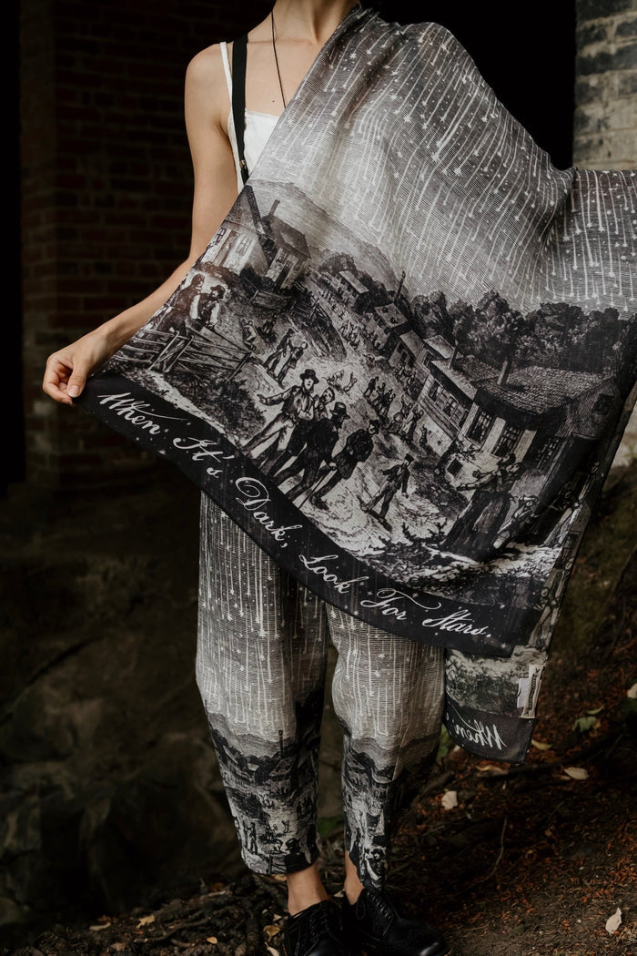 Model wearing the Stargazer Scarf featuring antique night sky illustrations and the quote "When it's dark, look for stars" – Market of Stars