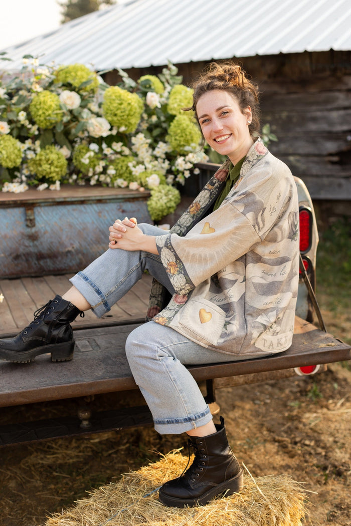 A cozy cardigan lined in fleece featuring Victorian collage artwork and the phrase “Life is nothing without friendship” – Market of Stars