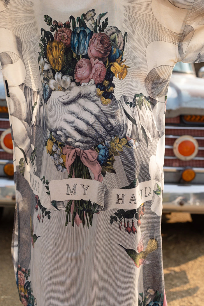 Clasped hands, radiant sun rays, and blooming florals in a joyful Victorian collage on our full-length Take My Hand Opera Duster
