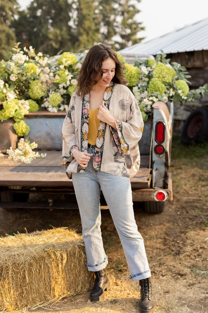 A joyful blend of 17th-century engravings, painted hearts, and hand-coloured florals on our cropped Take My Hand Pixie duster kimono – Market of Stars