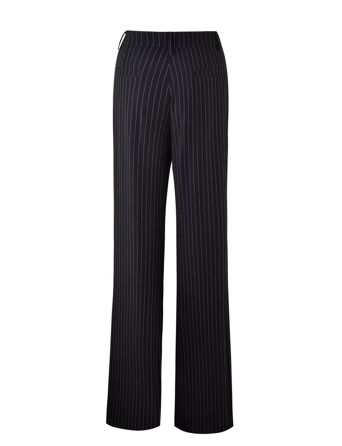 A rear view of the TIGERMIST TAMARA PANT - BLACK : PINSTRIPE trousers with vertical white pinstripes. These mid-rise waist pants feature two back welt pockets and have a wide-leg fit, perfect for a pinstripe suit pant look.