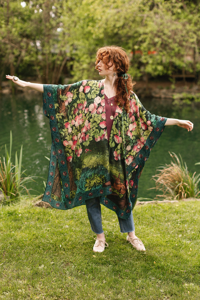 Model wearing a flowy duster ft. hand-coloured etching from the 1880s called The Bower of Roses - Market of Stars