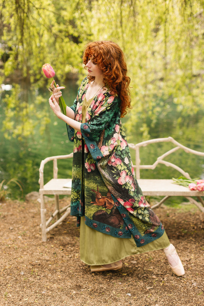 Model wearing a flowy duster ft. hand-coloured etching from the 1880s called The Bower of Roses - Market of Stars