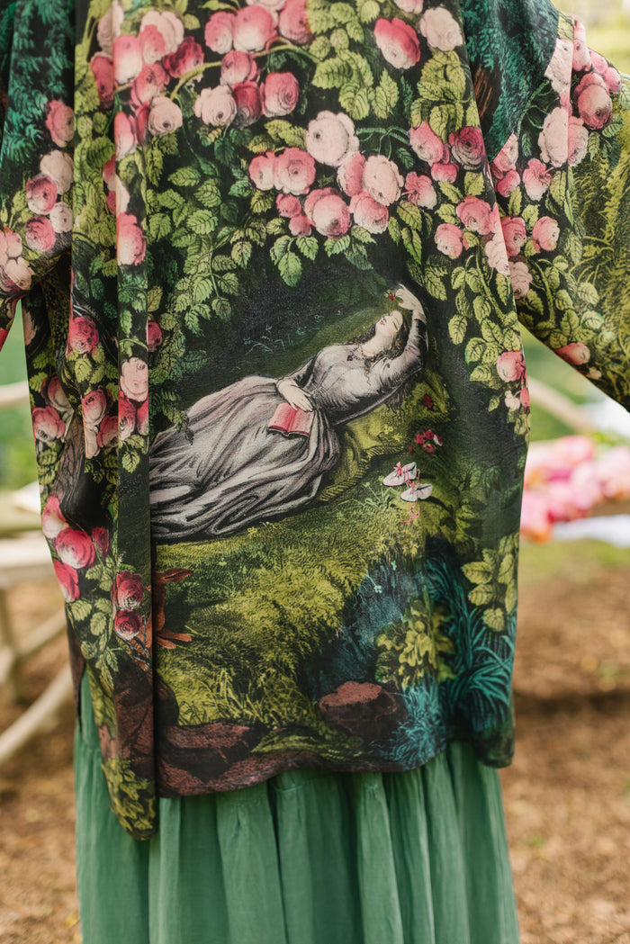 Model wearing a mid-length duster robe ft. hand-coloured etching from the 1880s called The Bower of Roses - Market of Stars