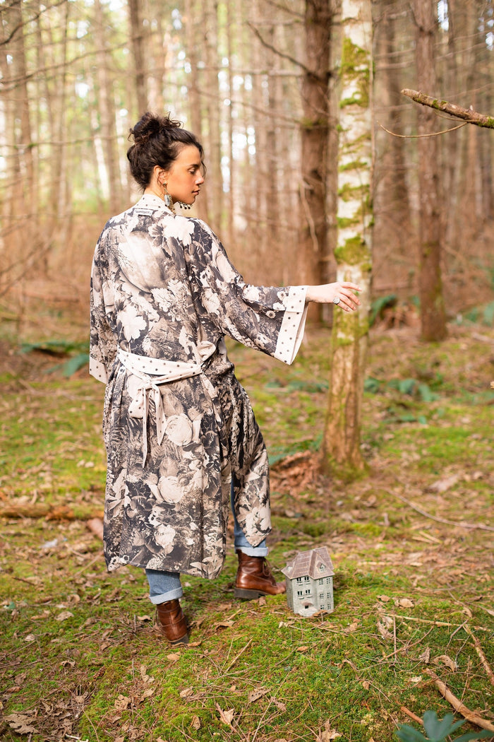 Model wearing Looking Glass Opera Robe featuring grown-up Alice Liddell, Victorian botanicals, and celestial star and moon accents inspired by Wonderland – Market of Stars.