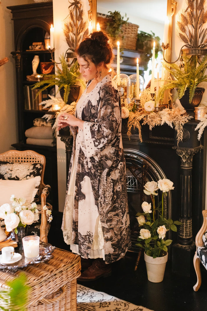 Model wearing Looking Glass Opera Robe featuring grown-up Alice Liddell, Victorian botanicals, and celestial star and moon accents inspired by Wonderland – Market of Stars.