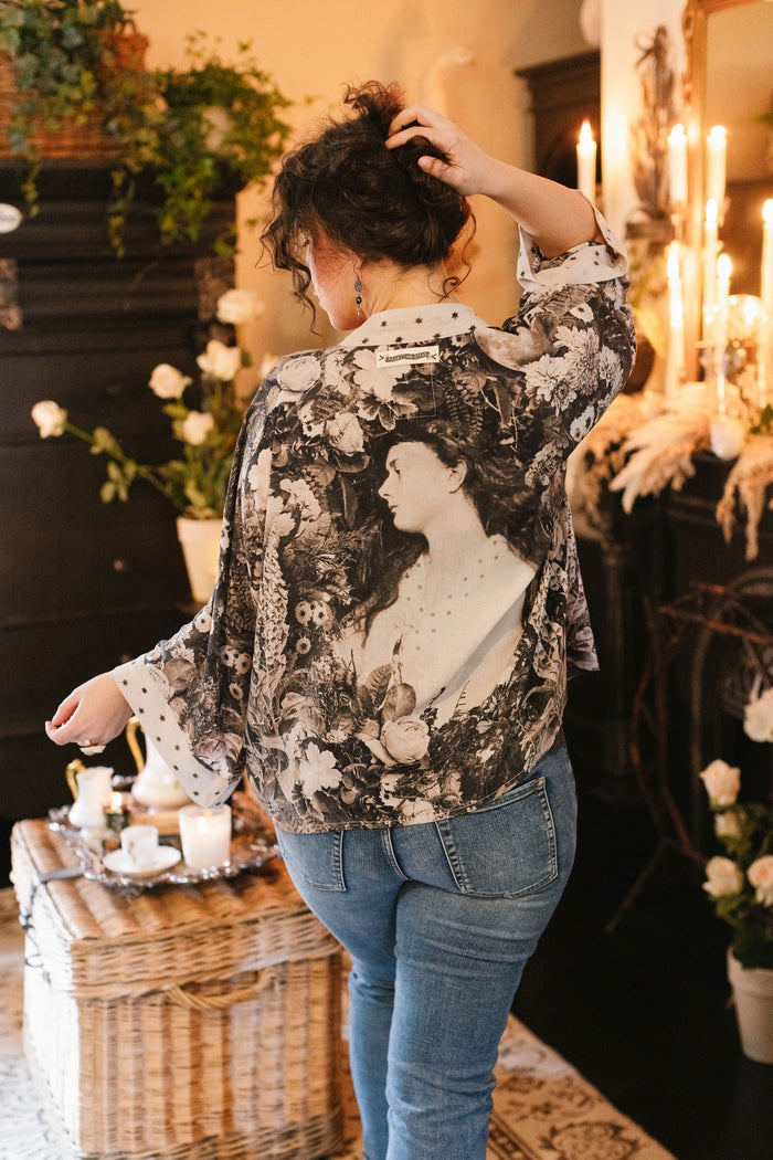 Model wearing Looking Glass Cropped Kimono featuring grown-up Alice Liddell, rare Victorian botanicals, and celestial star and moon accents inspired by Wonderland – Market of Stars.