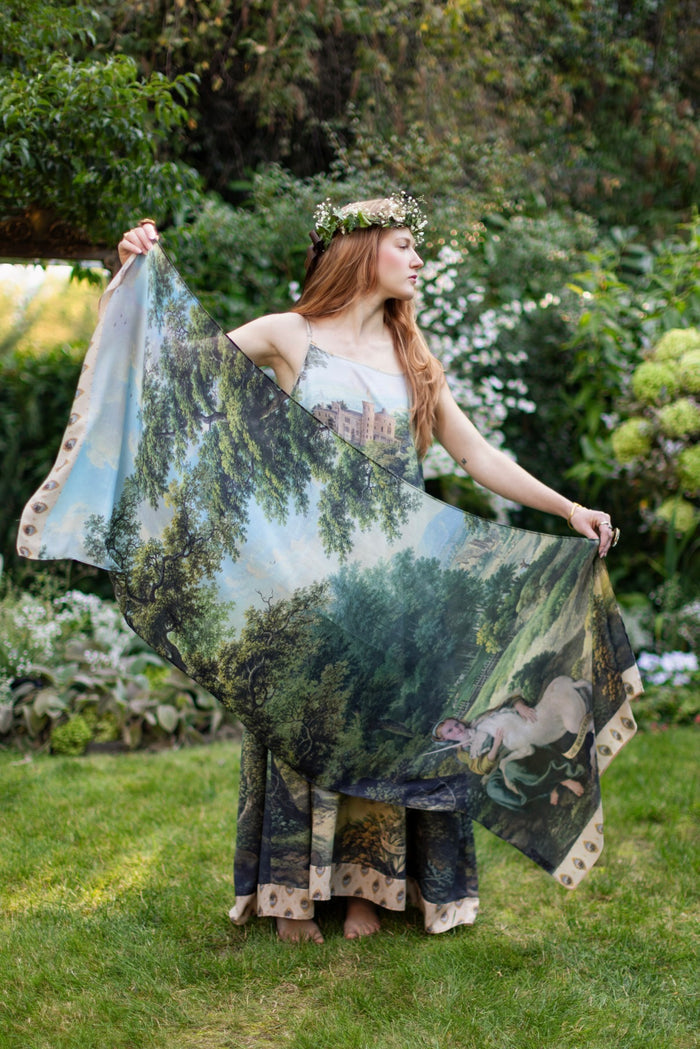 Model wearing a bamboo-viscose scarf ft. vintage artwork & unicorn lorn set against a mossy-green landscape — a romantic piece for the modern dreamer - Market of Stars