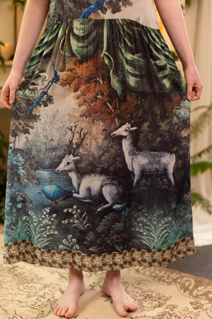 Model wearing our Theatre of Dreams Slip Dress featuring whimsical deer and birds from Jennifer Lanne’s romantic paintings – Market of Stars