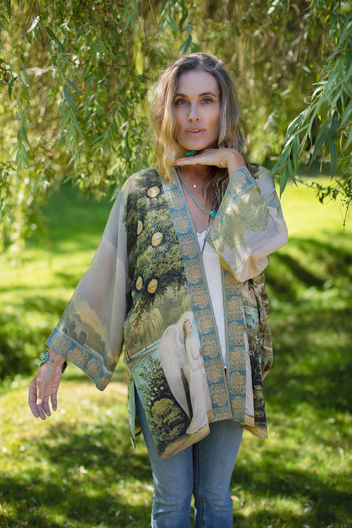 Model wearing Tree of Life Matinée Duster in aquas and verdant greens inspired by antique textiles – Market of Stars