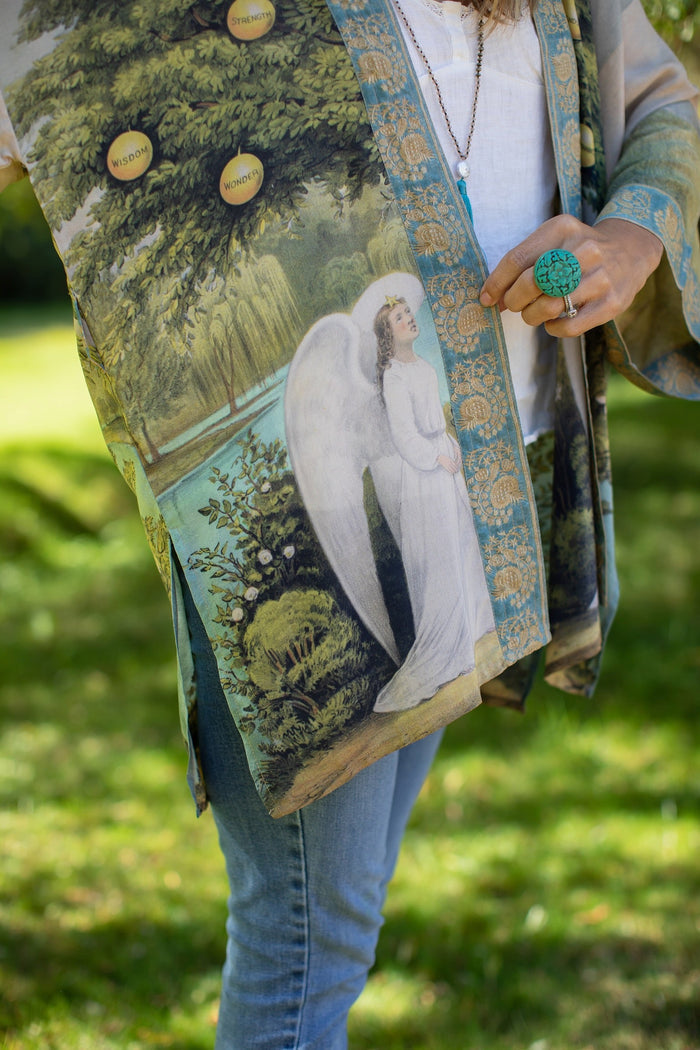 Model wearing Tree of Life Matinée Duster in aquas and verdant greens inspired by antique textiles – Market of Stars