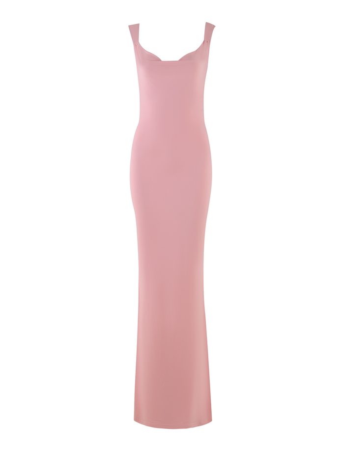 The ZITA DRESS - PINK by TIGERMIST features a baby pink bodycon silhouette with wide shoulder straps, a subtle sweetheart neckline, and an elegant maxi length, shown sleeveless against a white background.
