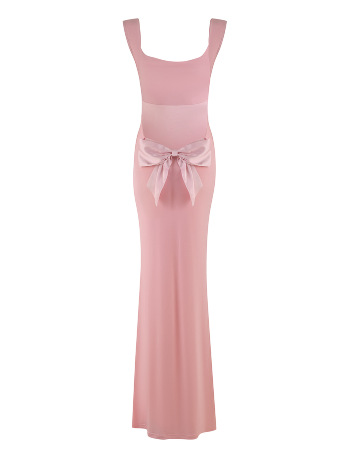 The TIGERMIST ZITA DRESS - PINK : BABY PINK is a sleeveless maxi dress with wide straps, a fitted bodice, and a large decorative bow at the waist.